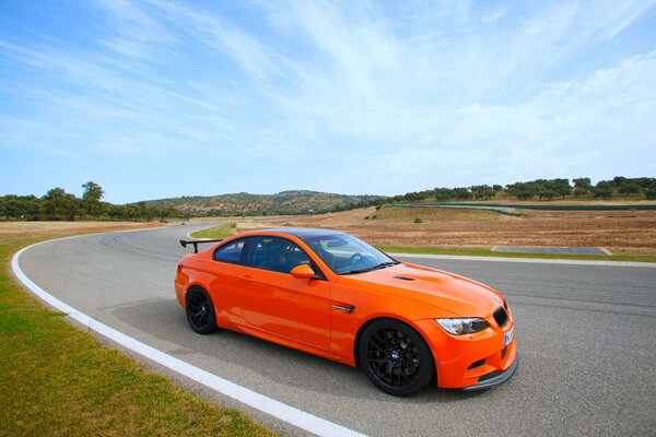 Orange sports car in action