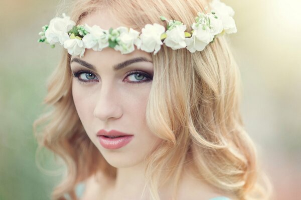 Beautiful blonde with a wreath on her head