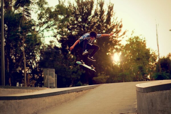 A young man on a skateboard performs a trick