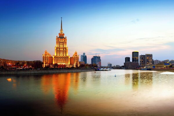 The lights of evening Moscow and the glare in the pond