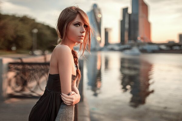 Girl on the background of the river