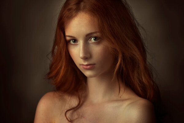 A red-haired girl with a deep look