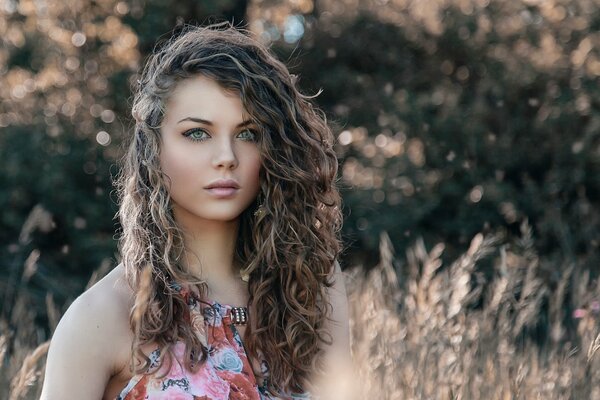 Portrait of a beautiful girl in the field