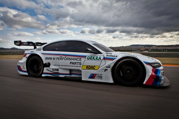 A sports car is driving on the highway