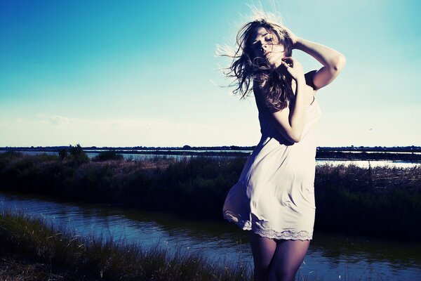 Girl in nature hair in the wind