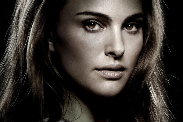 Natalie Portman on a dark background