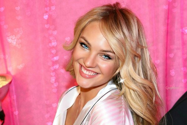 Candice with blue eyes smiles