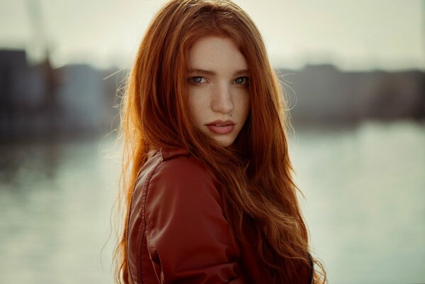 A girl with red hair and freckles