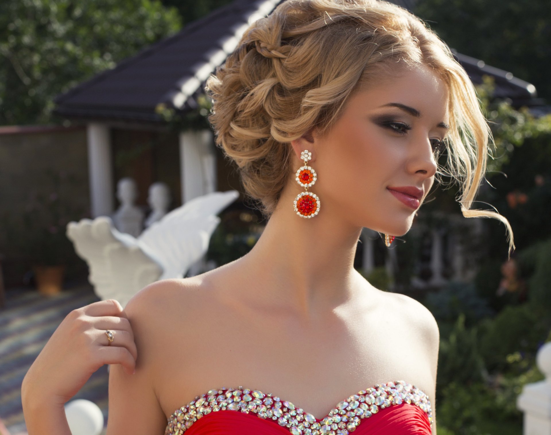 girl beautiful make-up view earrings dress hand