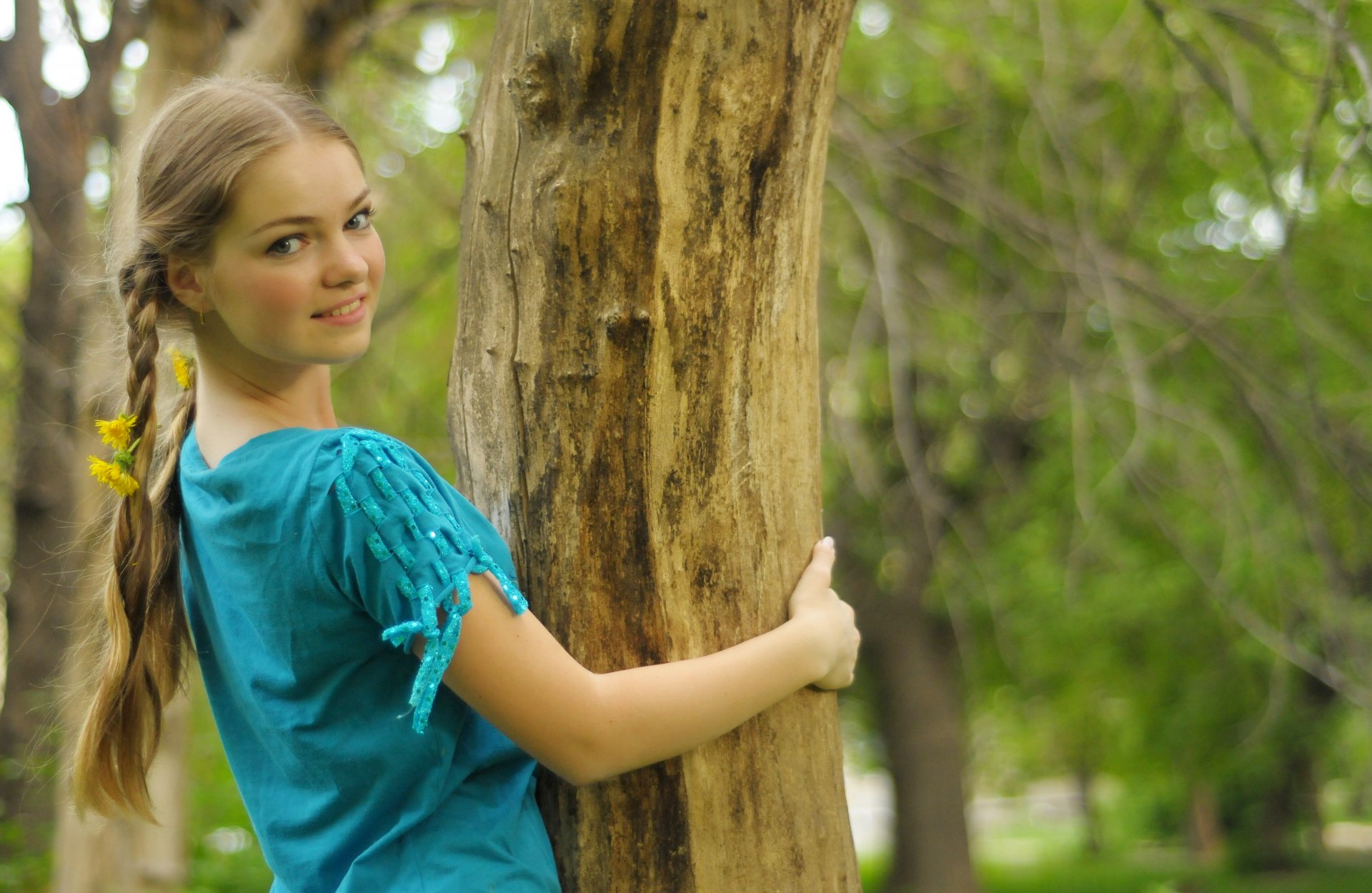 girl gray eyes blonde spit dandelions tree smile