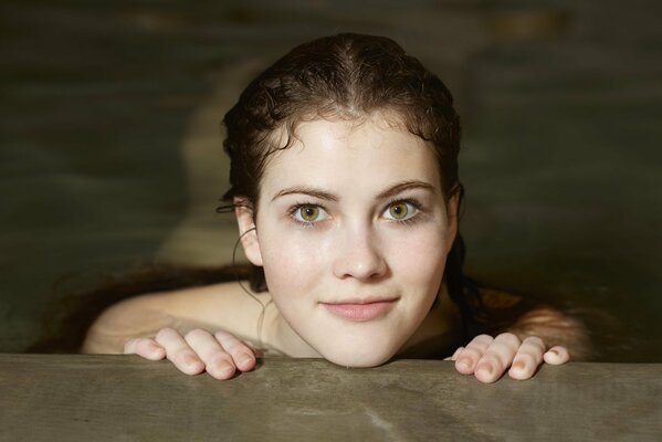 A look from the water - a green-eyed brown-haired woman