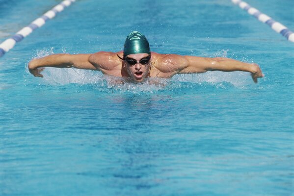 Swimmer in the pool at the water competition