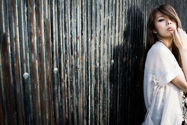 Asian woman with short hair on a dark background