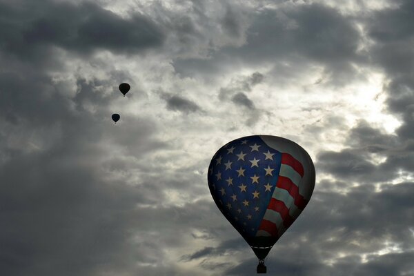 Balloons in a cloudy sky