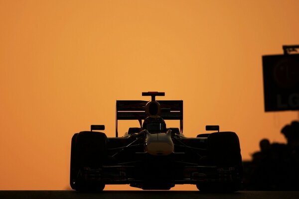 A racing car on a yellow background