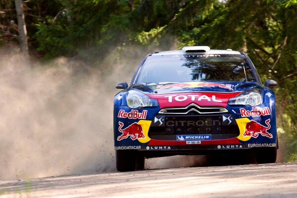 Racing Citroen rides on a dusty road