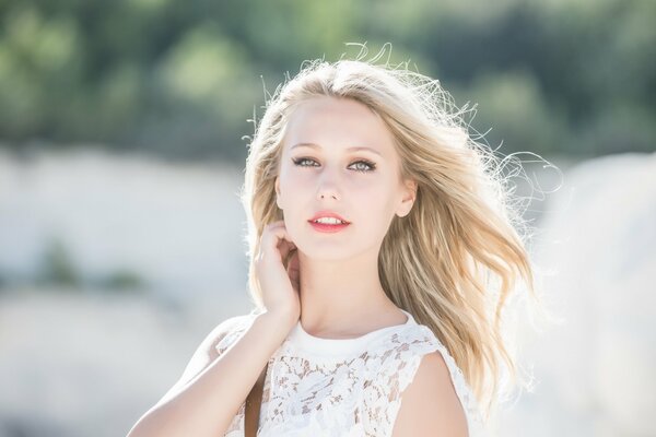 Blonde in a white dress with flowing hair