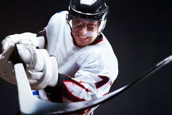 A game of hockey. Hockey player with a stick