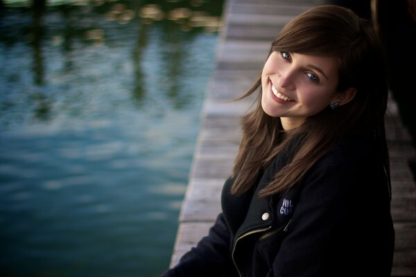 Funny girl on the lake shore