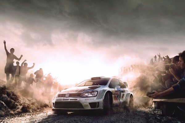 A photo at sunset of a volkswagen polo raising dust at a red bull rally