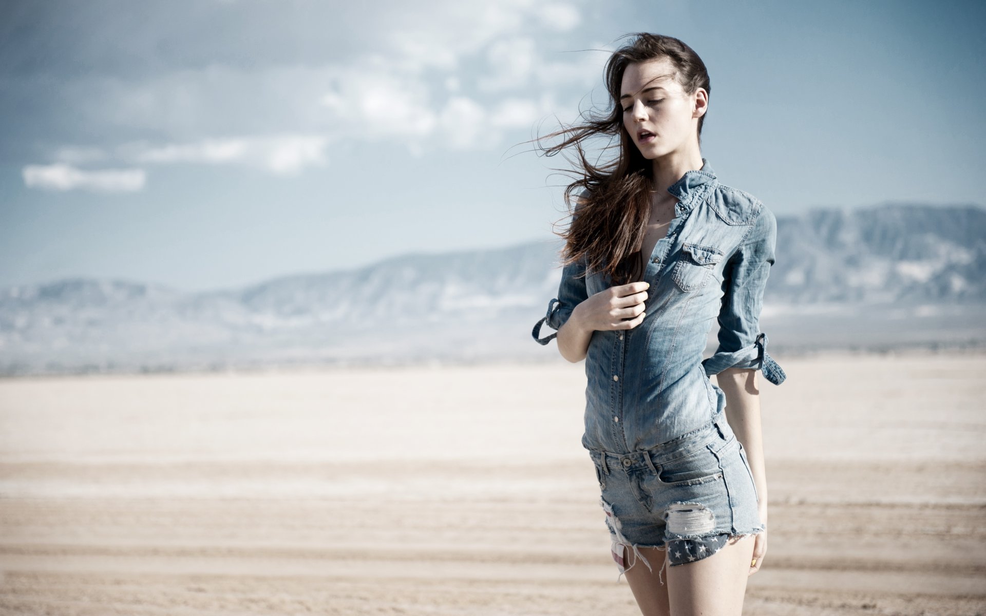 girl hair jeans shorts wind sun desert