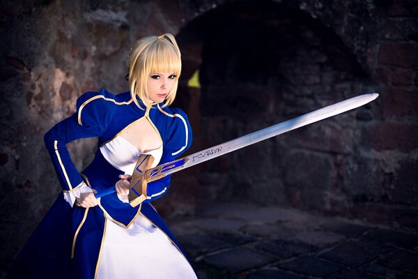 A girl with a sword in a blue dress