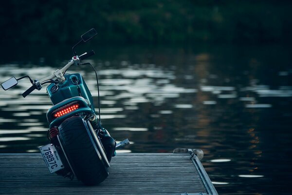 Invited flowers motorcycle on the background of the river