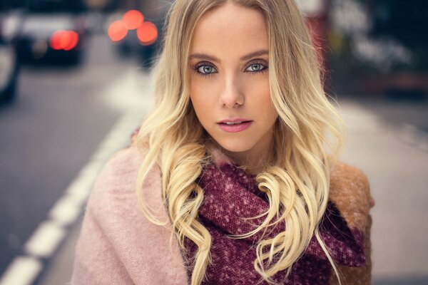 Beautiful blonde girl in pink blouse