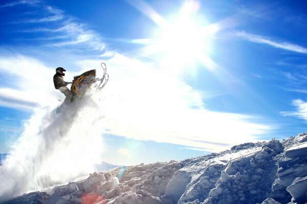 Soar into the sky to the sun on a snowmobile