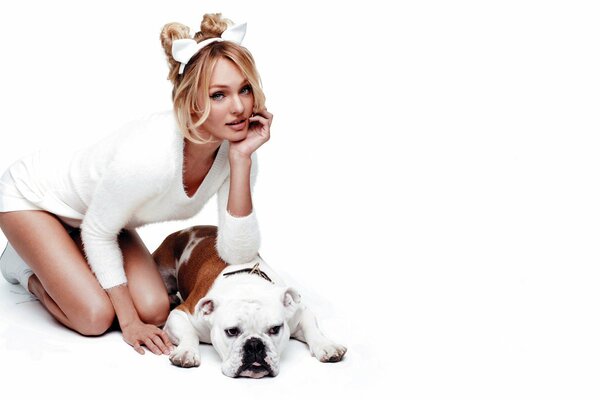 Blonde in white with a white dog