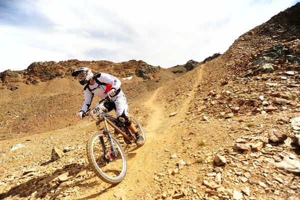 Cyclist riding on a sharp descent