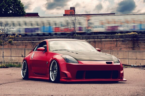 Red Nissan understated tuning