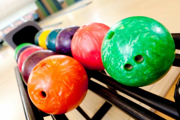 Bright bowling balls on a stand