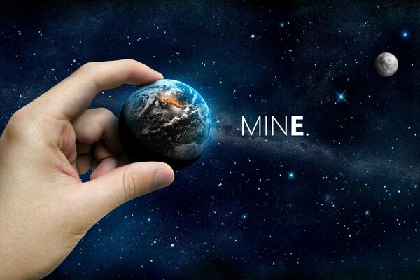 Pictured hands holding a mini planet in space