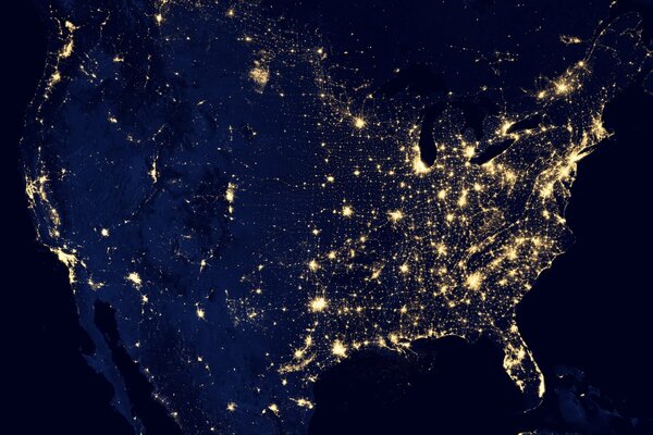 Planet earth at night in the USA on the background of lights wallpaper