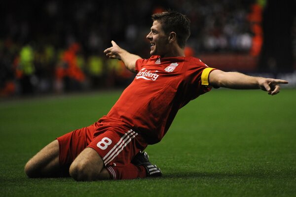 Steven Gerrard in red uniform on the football field