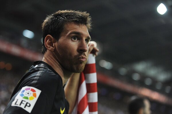 Lionel Messi is standing in the stadium in close-up