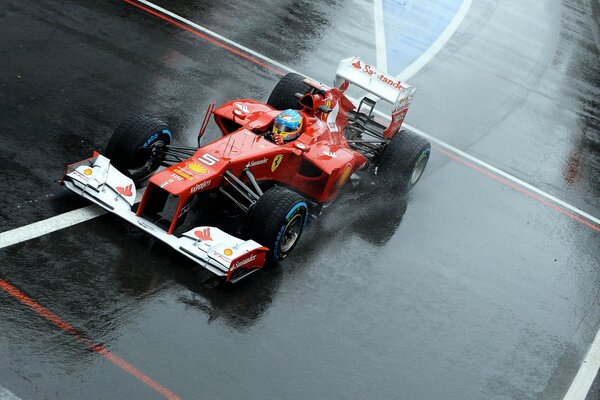 Ferrari during the race on a wet track
