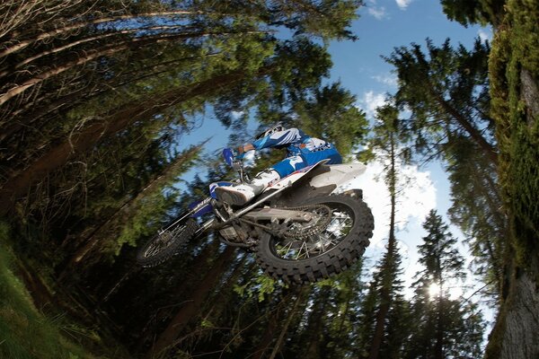 An unusual angle of a rider on a motorcycle