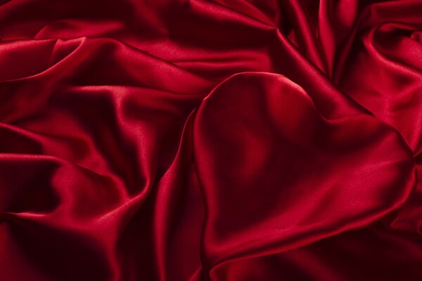 A heart made of folds of red fabric