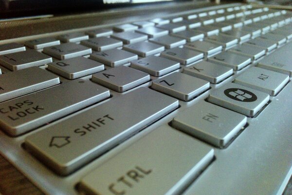 Clavier d ordinateur portable gris bas fonctionnant sous windows