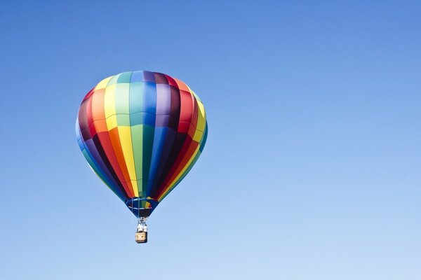 Multicolored balloon on a blue sky background