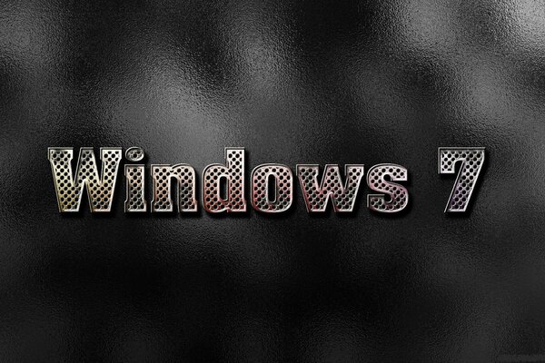 Image pour l économiseur d écran Windows 7 en grosses lettres au milieu sur un fond sombre