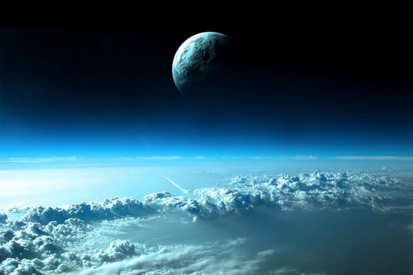 View of the moon from the earth s atmosphere above the clouds