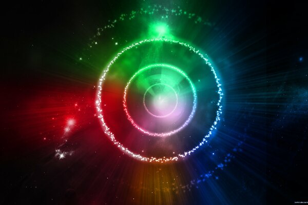 Círculos multicolores con resplandor en el universo