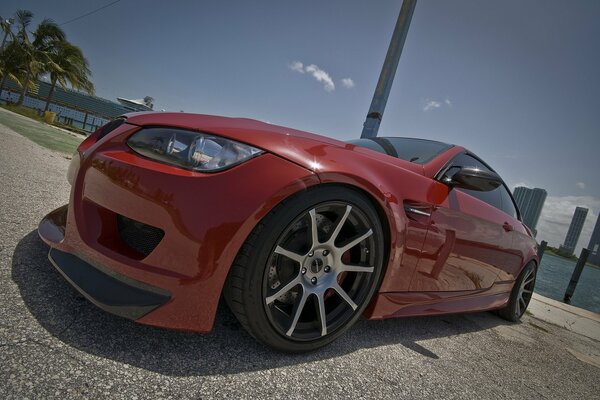 Red BMW on the sky background