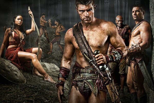 Gladiators beautiful men with a girl