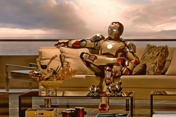 Iron Man is sitting on the couch