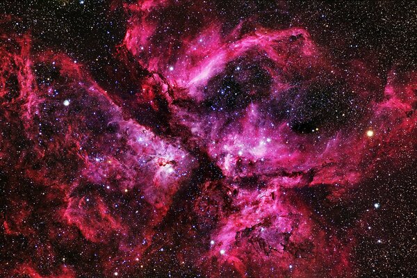 Nebulosa rosa en el espacio con estrellas