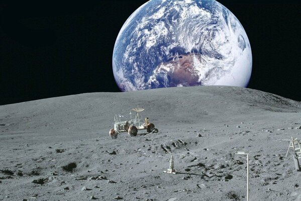 Lunar car on the background of planet Earth